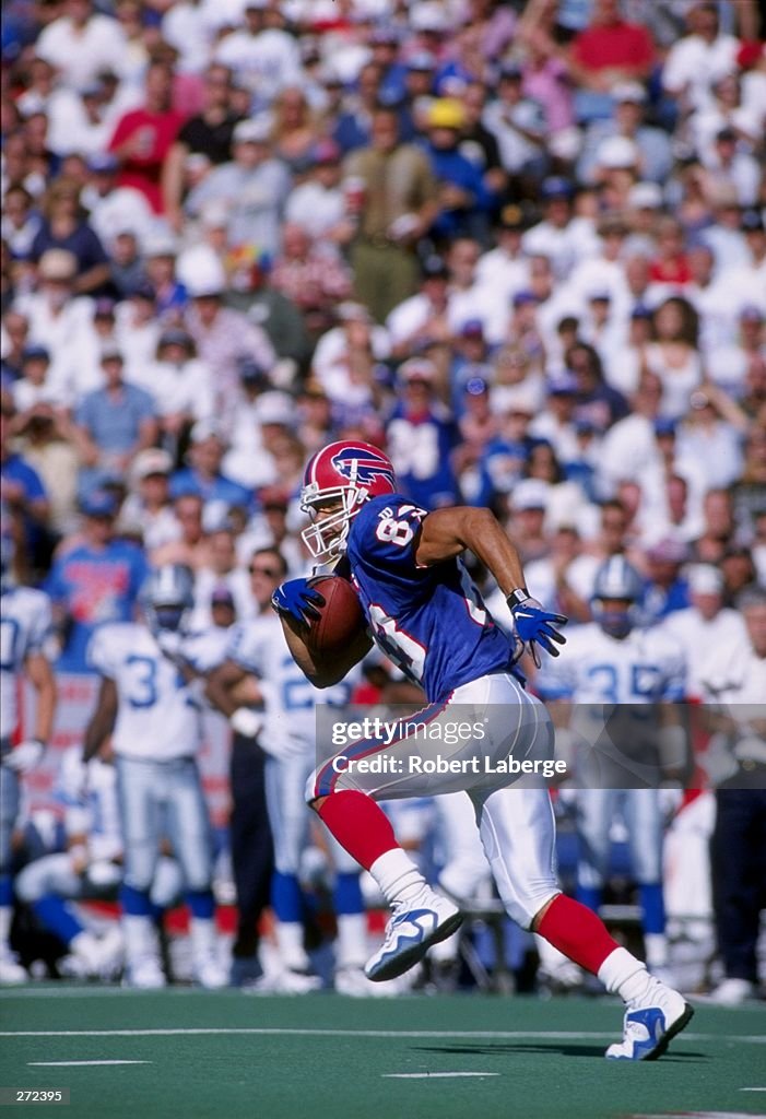 Andre Reed Highlights Wide receiver Andre Reed of the Buffalo Bills moves the ball during a ...