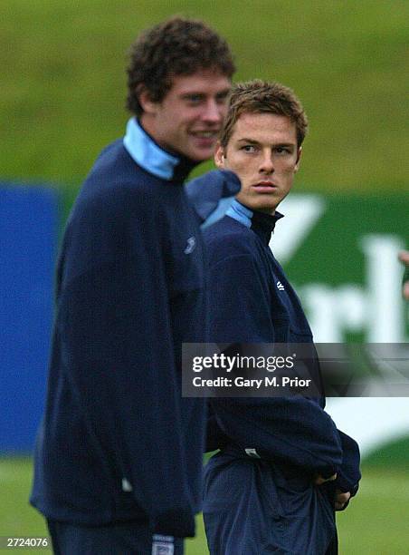 Scott Parker and Wayne Bridge look on during England football training at the Cliff training ground on November 13, 2003 in Manchester, England....