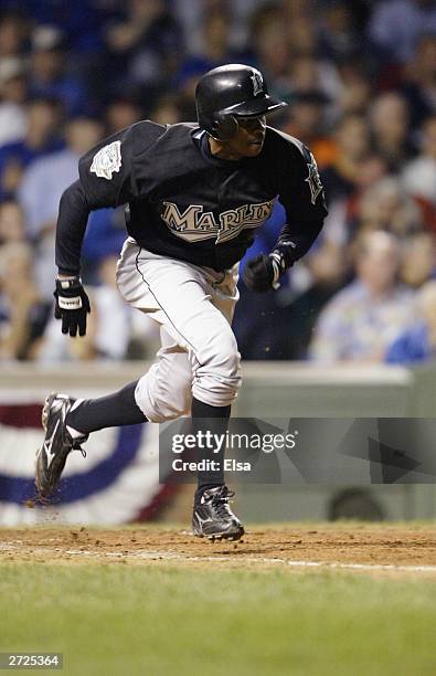 Center fielder Juan Pierre of the Florida Marlins runs to first during game two of the National League Championship Series against the Chicago Cubs...