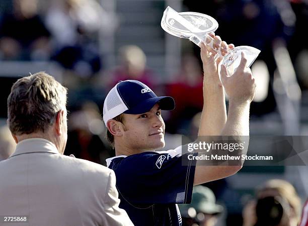 Andy Roddick is presented the ATP Champions Race trophy during the Tennis Masters Cup November 13, 2003 at the Westside Tennis Club in Houston, Texas.