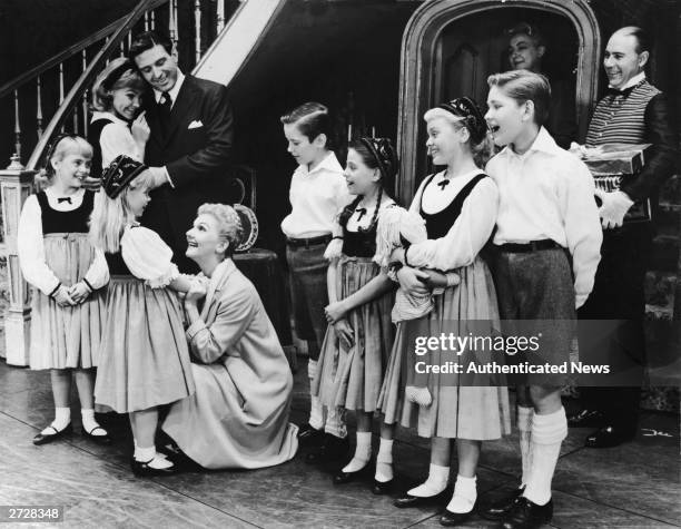 Actors Mary Martin, Theodore Bikel, Kurt Kaszner, and others portray the von Trapp family in a scene from the Broadway play, 'The Sound of Music,' at...