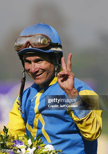 Alex Solis aboard Pleasantly Perfect smiles as he holds up two fingers after the victory in the $4 Million Breeders' Cup Classic, Powered by Dodge...