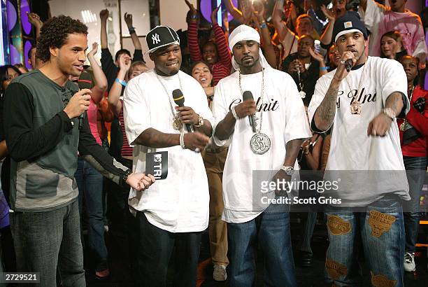 Cent and G-Unit appear onstage with MTV VJ Quddus during "Spankin' New Music Week" on MTV's Total Request Live at the MTV Times Square Studios...