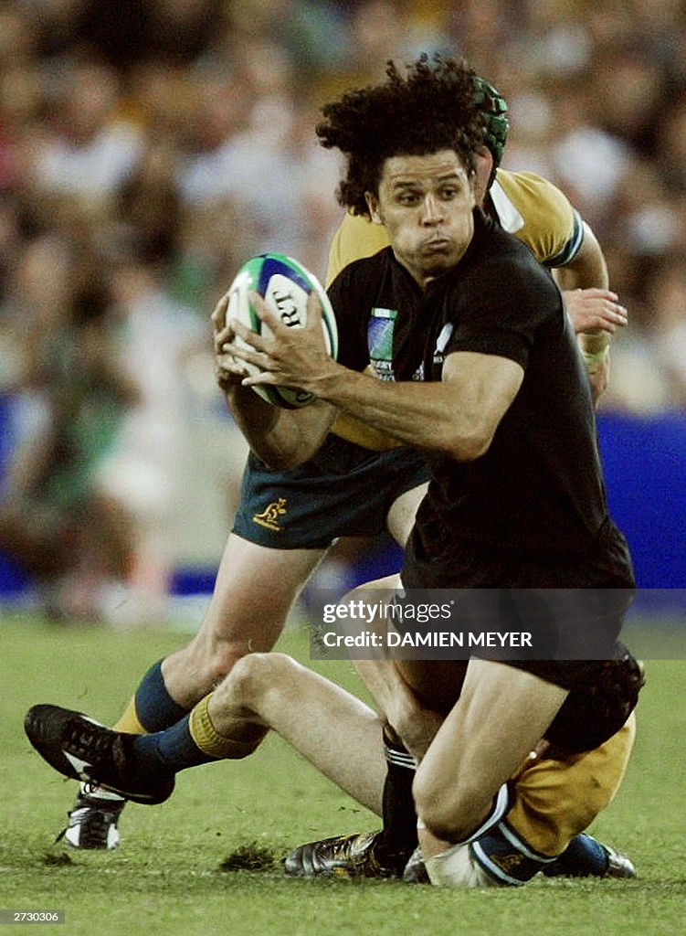 Tom Howlett Rugby All Blacks winger Doug Howlett is tackled by an unidentified... News ...