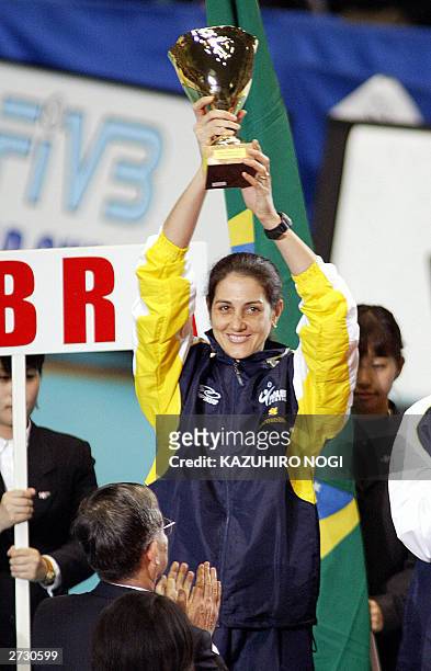 Brazilian volleyball team captain Fernanda Venturini holds up the second place trophy during the awards ceremony at the World Cup women's volleyball...
