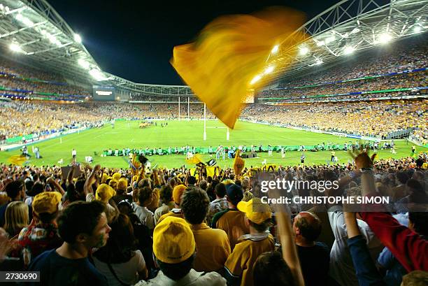 Australian fans cheer on their team during the Rugby World Cup semi-final between Australia and New Zealand at Telstra Stadium in Sydney 15 November...