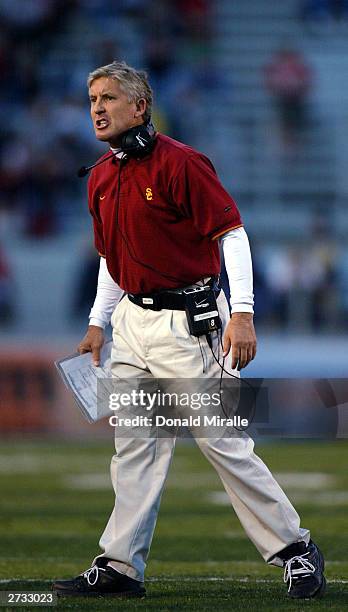 Head Coach Pete Carroll of the USC Trojans gives orders to his during the 1st period of their game at the Arizona Stadium on November 15, 2003 in...