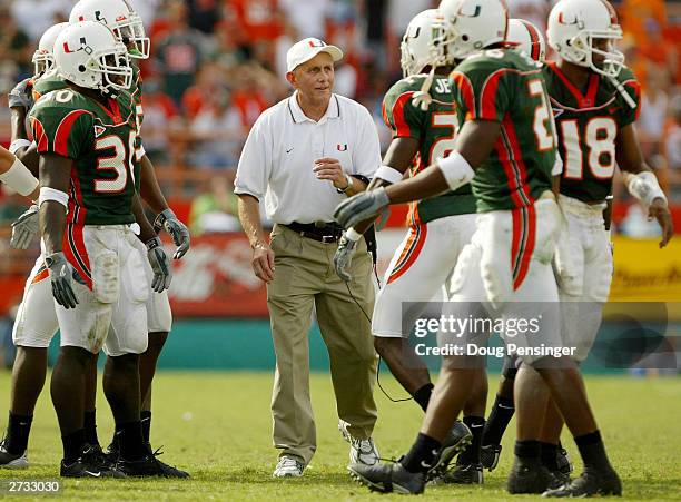 Head coach Larry Coker encourages his Miami Hurricanes against the Syracuse Orangemen as the Canes defeated the Orangemen 17-10 during NCAA football...