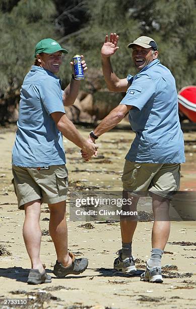 Guy Andrews and Bernie Shrosbree celebrate at the finish of The Cadbury Schweppes Mark Webber Challenge on November 16, 2003 in Tasmania, Australia. .