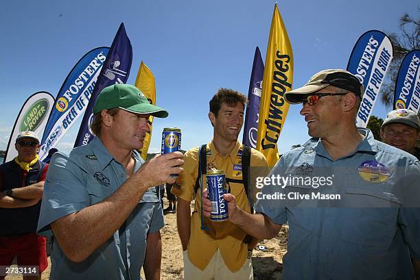 Mark Webber, Guy Andrews and Bernie Shrosbree celebrate at the finish of The Cadbury Schweppes Mark Webber Challenge on November 16, 2003 in...