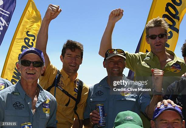 Mark Webber, James Tompkins and Bernie Shrosbree celebrate at the finish of The Cadbury Schweppes Mark Webber Challenge November 16, 2003 in...