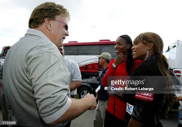 Tennis players Venus and Serena Williams meet Jimmy Spencer, driver of the Sirius Satellite Radio Dodge, during the Williams sisters' guided tour of...
