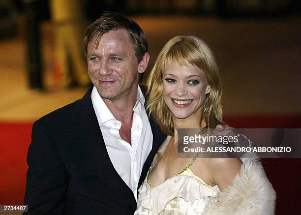 Actress Heike Makatsch arrives with an unidentified partner for the UK premiere of the film "Love Actually", at the Odeon Cinema, Leicester Square in...
