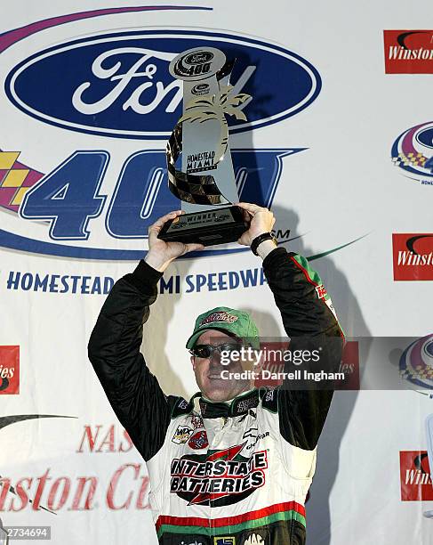 Bobby Labonte, driver of the Joe Gibbs Racing Interstate Batteries Chevrolet celebrates winning the NASCAR Winston Cup Ford 400 on November16, 2003...