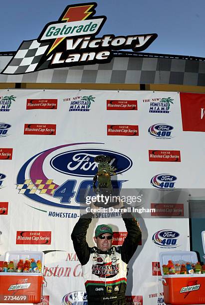 Bobby Labonte, driver of the Joe Gibbs Racing Interstate Batteries Chevrolet celebrates winning the NASCAR Winston Cup Ford 400, on November16, 2003...