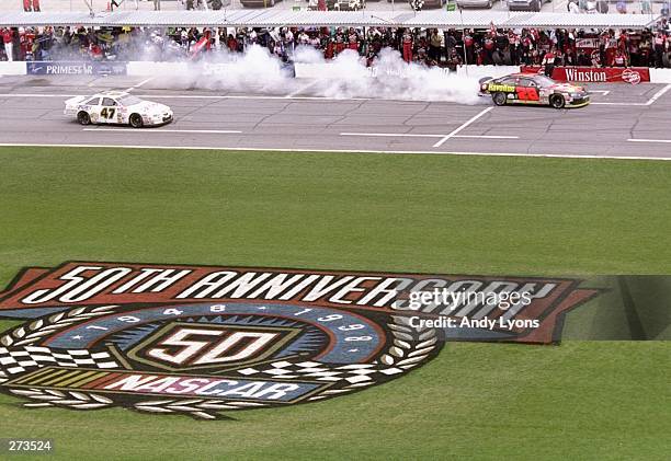 Kenny Irwin Jr. #28 is pursued by Billy Standridge out of pit row during the Nascar Daytona 500 at the Daytona International Speedway in Daytona...