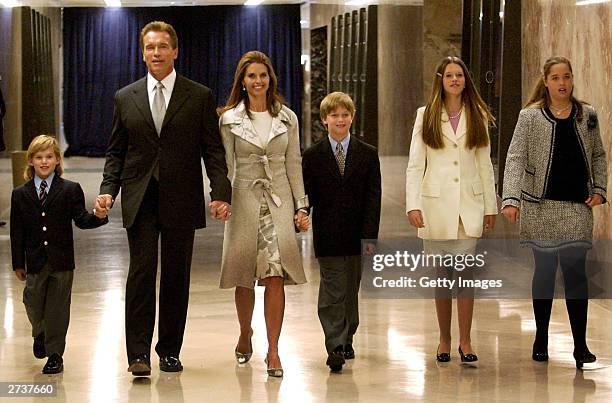 California Governor-elect Arnold Schwarzenegger walks with his wife Maria Shriver and their four children to his inaugural ceremony at the State...
