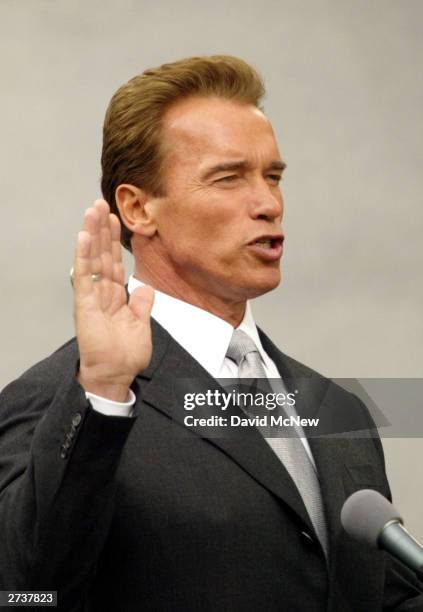 Governor-elect Arnold Schwarzenegger takes the oath of office November 17, 2003 in Sacramento, California. Schwarzenegger is taking office as the...