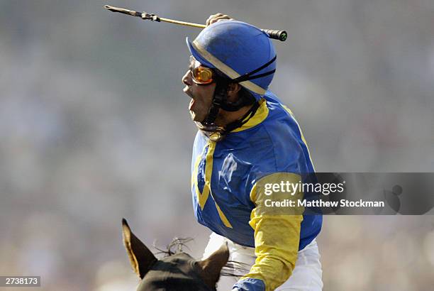 Alex Solis celebrates winning aboard horse, Pleasantly Perfect in the $4 Million Breeders' Cup Classic, Powered by Dodge part of the 2003 Breeders'...