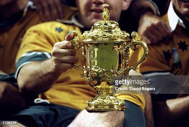 Australia hold the Web Ellis trophy after victory over France in the Rugby World Cup Final at the Millennium Stadium in Cardiff, Wales. Australia won...