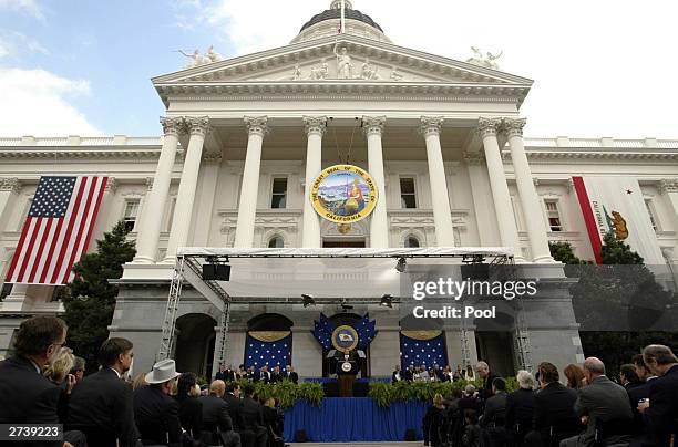 California Governor Arnold Schwarzenegger delivers his inaugural speech on the steps of the State Capitol November 17, 2003 in Sacramento,...