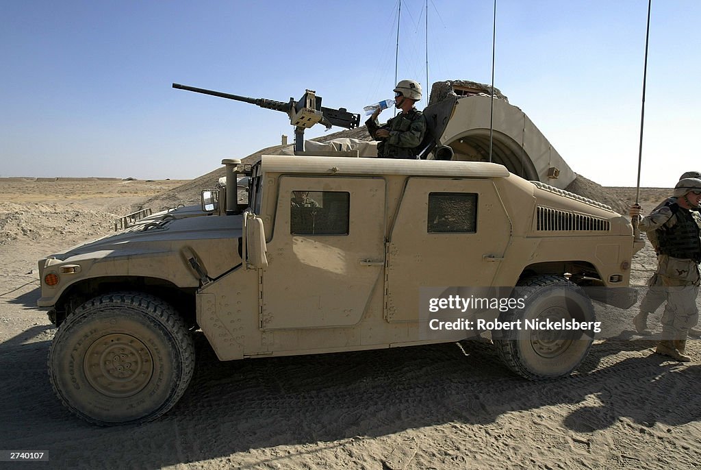 Rangers Using Humvee A new, more heavily armored US Army Humvee is parked in front of a ...
