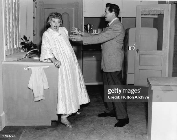 American actor Lucille Ball reacts to Cuban-born actor Desi Arnaz in a still from the television show, 'I Love Lucy', 1956.