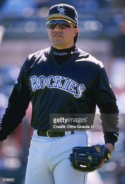 Vinny Castilla of the Colorado Rockies looks on during a Spring Training game against the San Francisco Giants at the Scottsdale Stadium in...