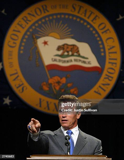 California Governor Arnold Schwarzenegger speaks to reporters during his first news conference as governor November 18, 2003 in Sacramento,...