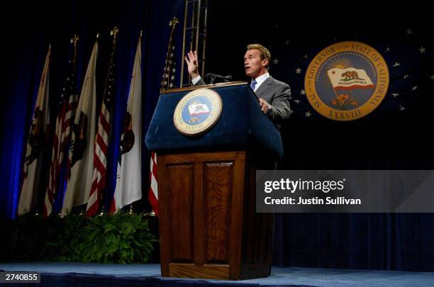 California Governor Arnold Schwarzenegger speaks to reporters during his first news conference as governor November 18, 2003 in Sacramento,...