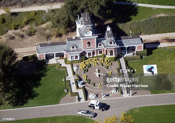 An aerial photo shows a Santa Barbara County Sheriff's vehicle in front of singer Michael Jackson's Neverland Ranch November 18, 2003 outside of...