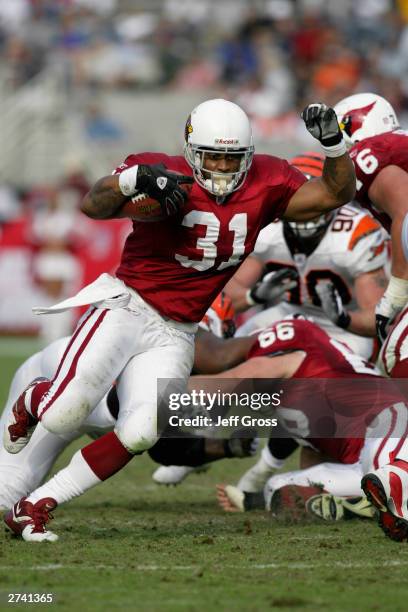 Running back Marcel Shipp of the Arizona Cardinals runs the ball for yardage during the game against the Cincinnati Bengals on November 2, 2003 at...