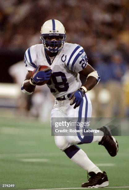 Running back Marshall Faulk of the Indianapolis Colts moves the ball during a game against the Pittsburgh Steelers at Three Rivers Stadium in...