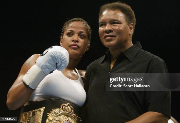 Boxer Laila Ali poses with her father, former heavyweight champion Muhammad Ali, after she defeated Suzy Taylor in two rounds at the Aladdin Casino...