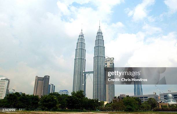 View of the 88-story Petronas Twin Towers, the tallest buildings in the world, in downtown Kuala Lumpur, Malaysia, March 12, 2002. The towers,...