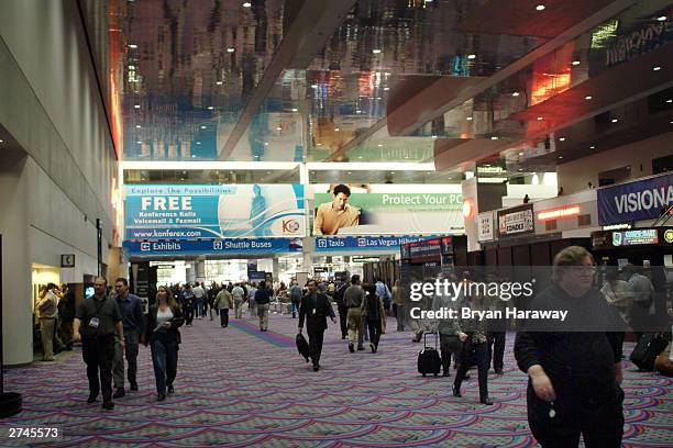 Attendees make their way to the many meetings, conferences and booth displays at COMDEX 2003 November 19, 2003 in Las Vegas, Nevada. COMDEX is an...