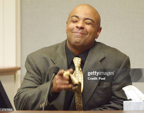 Defense witness, Nathan Perry, gestures during his testimony for the penalty phase of the trial of convicted sniper John Allen Muhammad in courtroom...