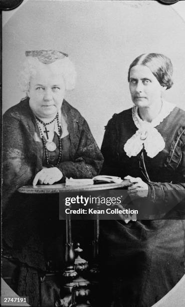 American suffragettes Susan B. Anthony and Elizabeth Cady Stanton sit at a desk together, circa 1870s.