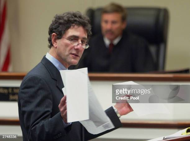 Defense attorney Jonathan Shapiro displays papers as he delivers his closing arguments as Judge LeRoy Millett, Jr. Listens during the penalty phase...