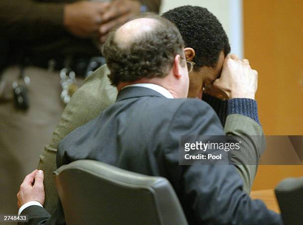 Defense attorney Peter Greenspun comforts convicted sniper John Allen Muhammad during the penalty phase of the trial of convicted sniper John Allen...