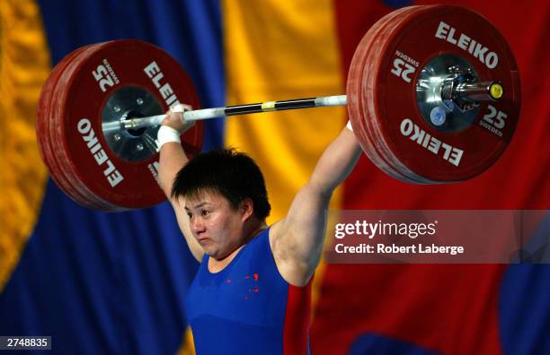 Shichun Shang of China lifts 120 Kilograms to beat the World Record at the Snatch and earn the Gold Medal during the Women's 75 Kilograms Group A...