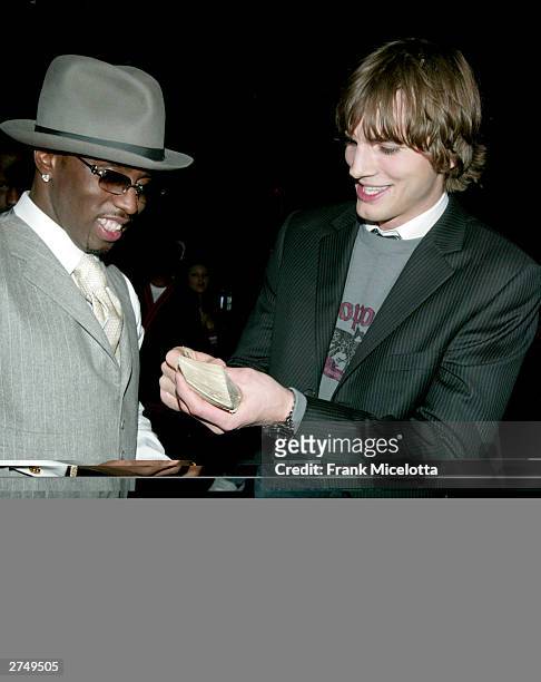 Rapper Sean "P Diddy" Combs and actor Ashton Kutcher pose backstage at VH1's Big In 2003 Awards on November 20, 2003 at Universal City in Los...