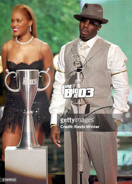 Singer Eve and rapper Sean "P Diddy" Combs present an award on stage at VH1's Big In 2003 Awards on November 20, 2003 at Universal City in Los...