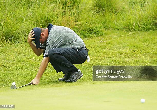 Jerry Kelly of USA reacts to a putt on the 14th hole during his match against K.J Choi of Korea and Peter Lonard of Australia during the second round...