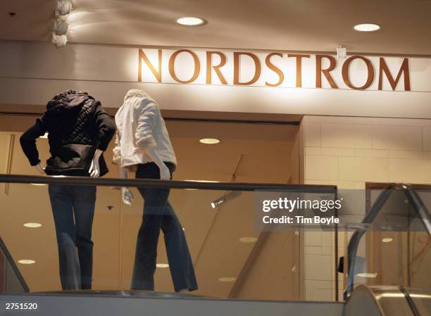 Two headless mannequins are seen near Nordstrom signage at its store November 21, 2003 in Chicago. Nordstrom, Inc. Reported net earnings of $45.5...