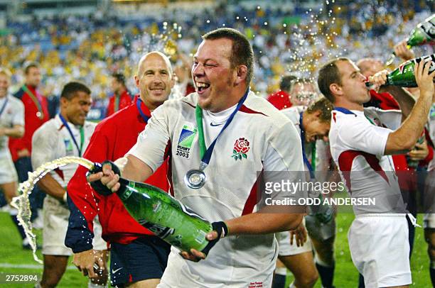 English hooker Steve Thompson celebrates after winning the Rugby World Cup final at the Olympic Park Stadium in Sydney, 22 November 2003. England...