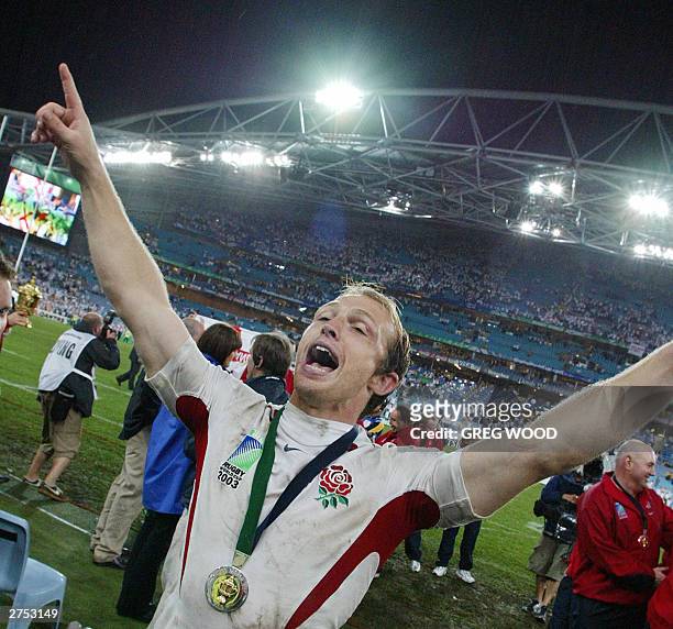 English scrumhalf Matt Dawson celebrates after England won the Rugby World Cup final at the Olympic Park Stadium in Sydney, 22 November 2003. England...