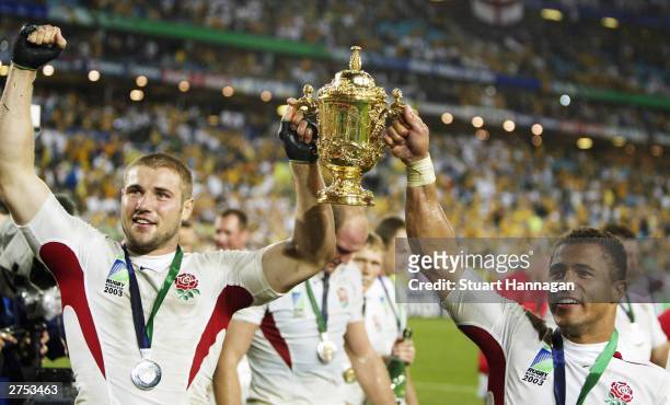 Ben Cohen of England and Jason Robinson hold up the Web Ellis Cup after the Rugby World Cup Final match between Australia and England at Telstra...