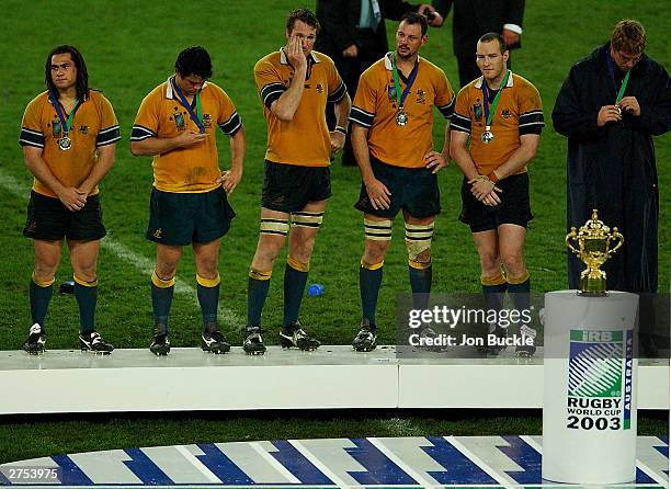 George Smith,Jeremy Paul,Justin Harrison, Matt Cockbain and Stirling Mortlock of the Wallabies stand dejected as they look on at the William Webb...