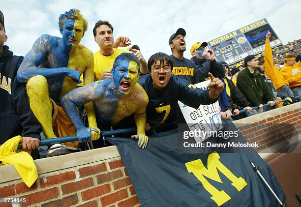 University of Michigan students and fans cheer before the 100th meeting between the Michigan Wolverines and the Ohio State Buckeyes November 22, 2003...